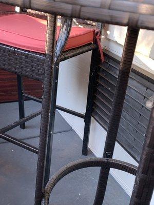 Full spider web on chair and table on balcony