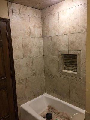 Shower nicho and tub surround.