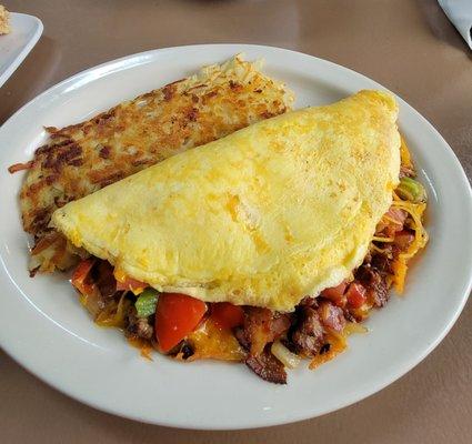 Ultimate Omelette with hash browns.