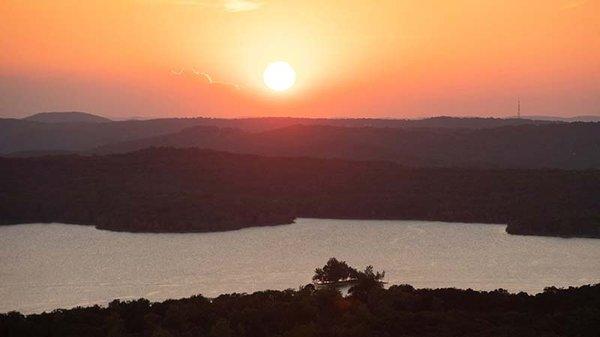 View the sunset over Table Rock Lake from atop Baird Mountain, Pink® Jeep® Tours Branson Sunset.