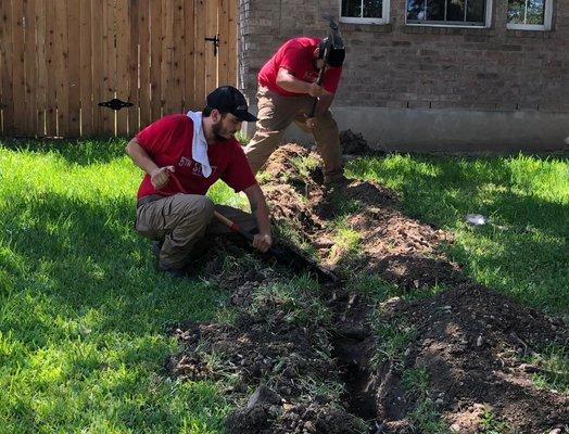 5th Street Services plumbers working on digging for a water line