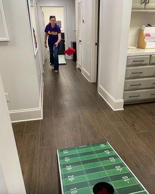 Wearing our purple & gold never gets old! Football season is back, and we are kicking it off with a team tailgate & corn hole...