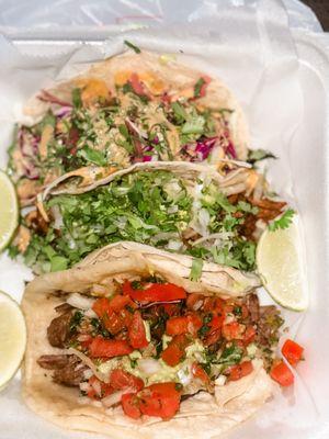 Tacos! Tacos! Tacos! Their tacos have fresh ingredients and are scrumptious. Pictured are Korean BBQ, Pastor and Carnitas.