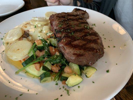 Steak with scallop potatoes and veggies