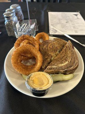 The Alderman sandwich and fresh onion rings with their special dipping sauce!