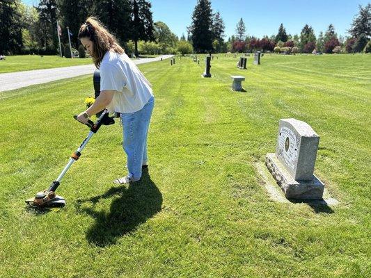 Visiting my Mommy and my daughter cleaning her grave.