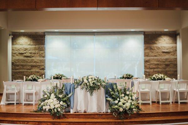 Sweet heart table and altar pieces by Mother Earth Flowers. Photo by Emily Rammelsberg Photography.