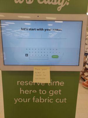 Kiosk with a sticky note asking you to press button on counter instead of using kiosk.