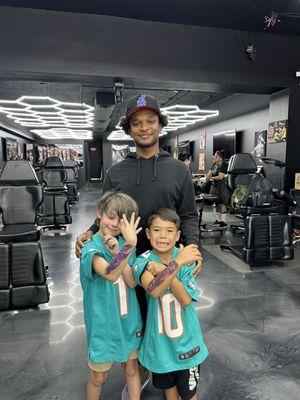 Showing off their new ink with their wonderful tattoo artist Noah