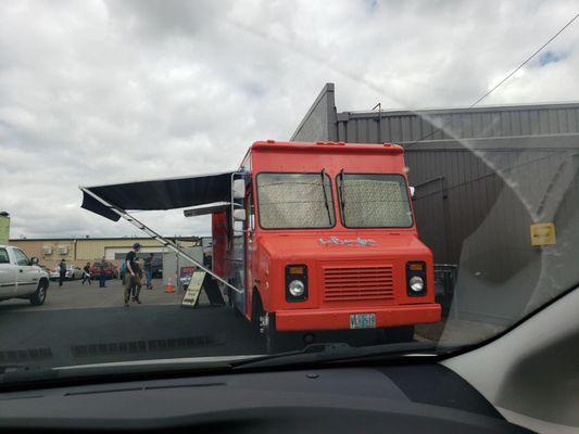 Fun and bright food truck in Dari Mart parking lot on west 11th