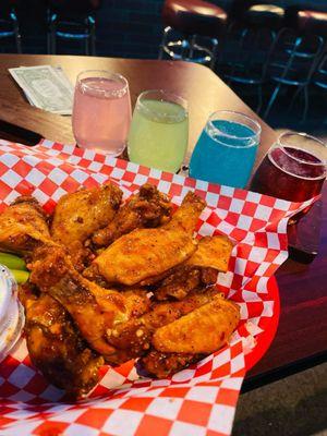 Hot lemon pepper wings, with a Hennessy drink flight