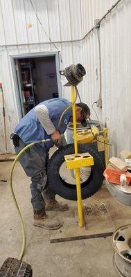 Winter tire stud installation.