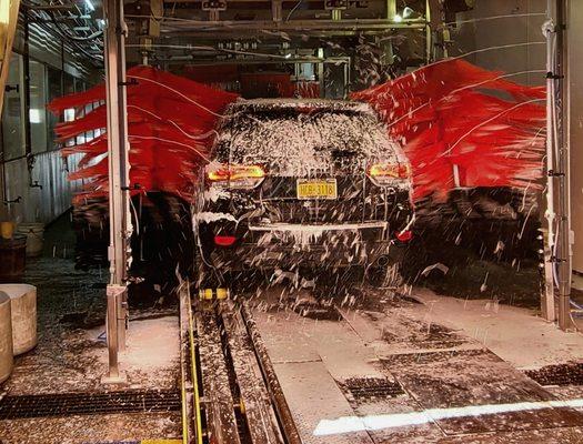 Car being washed, soaped, brand new machinery