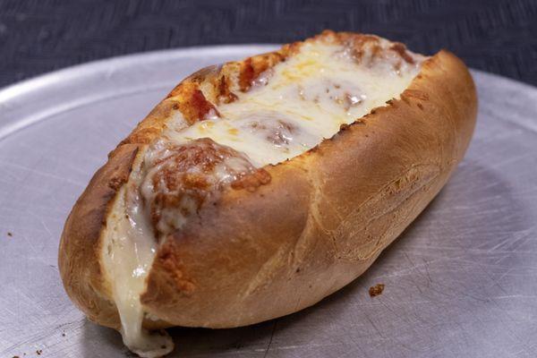 Crisp meatball hoagie covered in gooey cheese