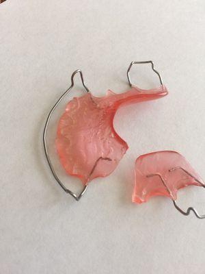 Broken retainer?? Come and see us! We offer both traditional metal wire retainers as well as cosmetic clear plastic retainers!