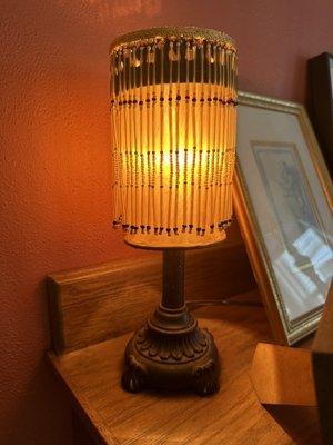 Beautiful fabric and metal lamp from the 1930's with glass beads.  Great working condition.