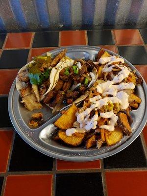 Kimchi fries with pork belly and chicken adobo tacos.