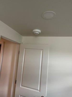 Smoke detectors in bedrooms, hallways and full fire and security alarm panels in basement.