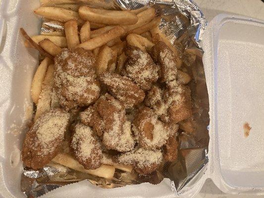 Boneless garlic butter parm on a bed of fries