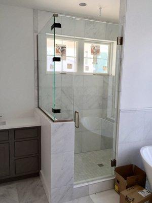 seamless, glass shower enclosure