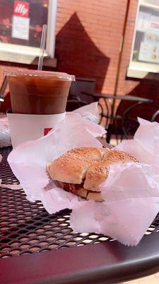 Iced latte and bagel breakfast sandwich