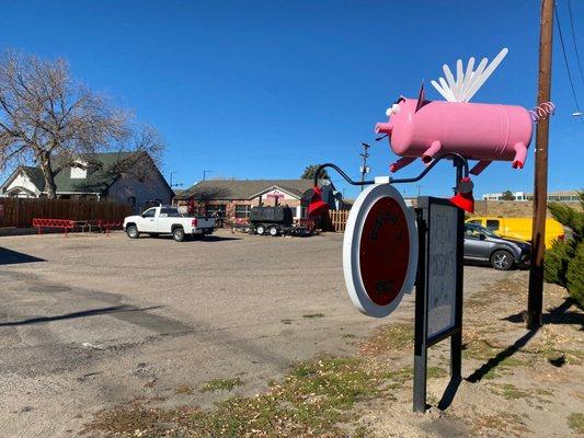 The building is set back from the road so just look for the pink pig.