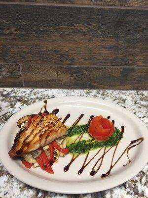 Pan seared salmon, over grilled fennel, mushrooms, and roasted peppers