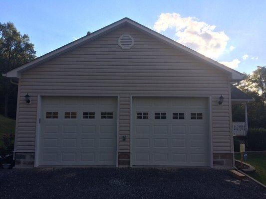 Carport converted to two car garage. 9'x8' Stratford 3000 doors with Stockton window inserts.