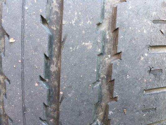 Another view of a dry rotted tire on the car sold