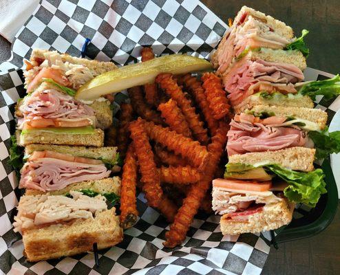 Sam's club sandwich with sweet potato fries.