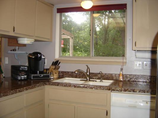 Kitchen with pantry, appliances included.