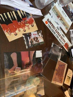 Tables are decorated with photos of locals-the local sports teams