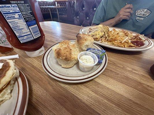 Meat lovers omelet with hash browns and biscuits