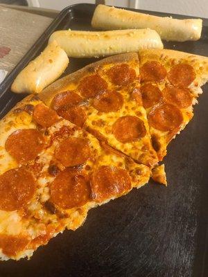 Cold pizza and cold cheese sticks