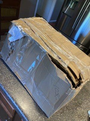 Damaged box by post office after paying $68 in shipping  and screen shot of phone where I'm on hold for 1.5 hours