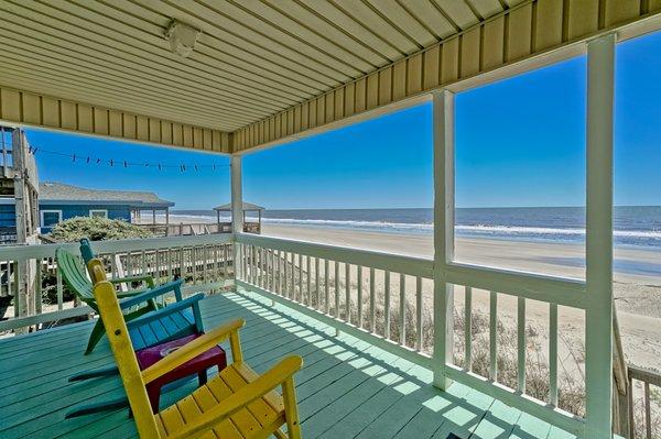 Feel the ocean breeze and kick back in your rocking chairs!