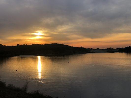 Sunset over the lake above the trail.