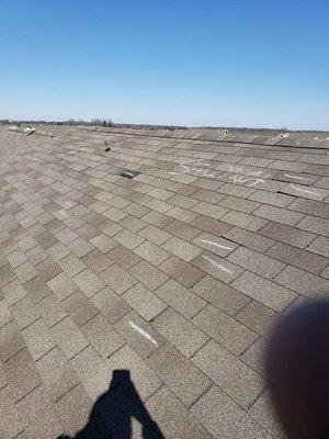 Marking damage on a roof in Westfield so we can start the insurance claim process.