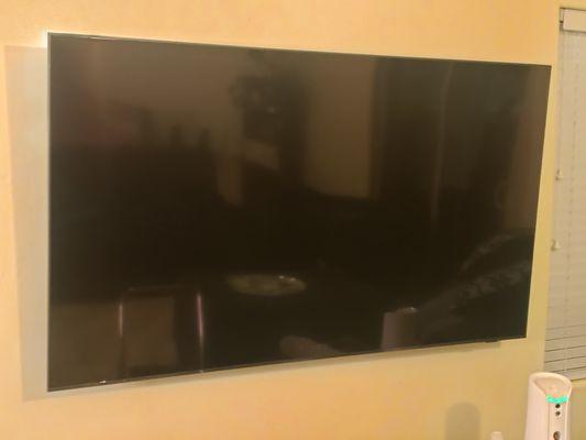 Newly mounted TV, wires concealed.