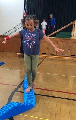 Student balancing during a Motor Perception class, a program funded by the Lakeshore PTA