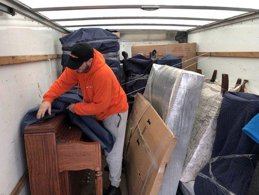 Packing a piano in a truck.