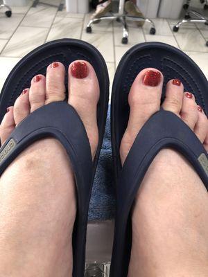 Beautiful pedicure with glittery red polish-snazzy!!!