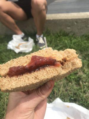 Classic pb and j sandwich on honey whole wheat bread