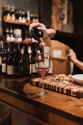 Pouring wine on tasting bar...