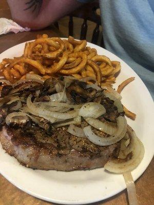 Steak with onions and curly fries