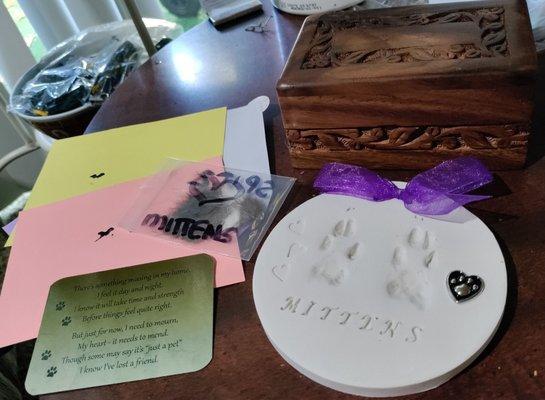 Nose prints, fur, paw prints, and the memorial card