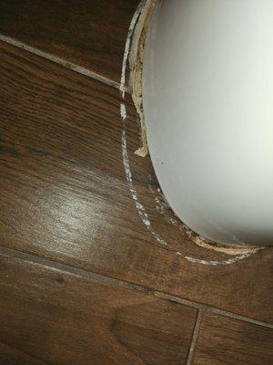 Base of toilet caulking need repairing.