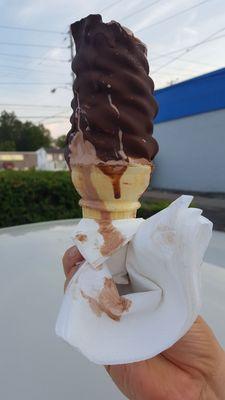 Good ice cream, wrong way to dip a cone.