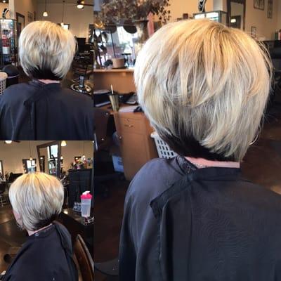 A line haircut with dark color underneath and blonde highlights. Hair by Nicole Winans.