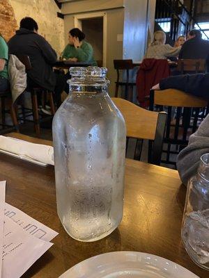 Milk bottle filled with cold water